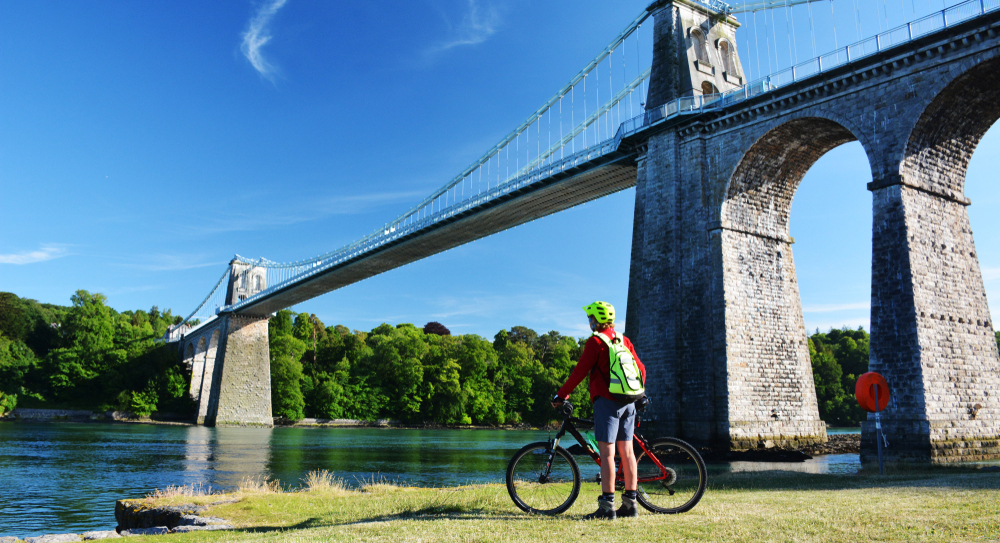 Cyclist by Menai Suspension Bridge